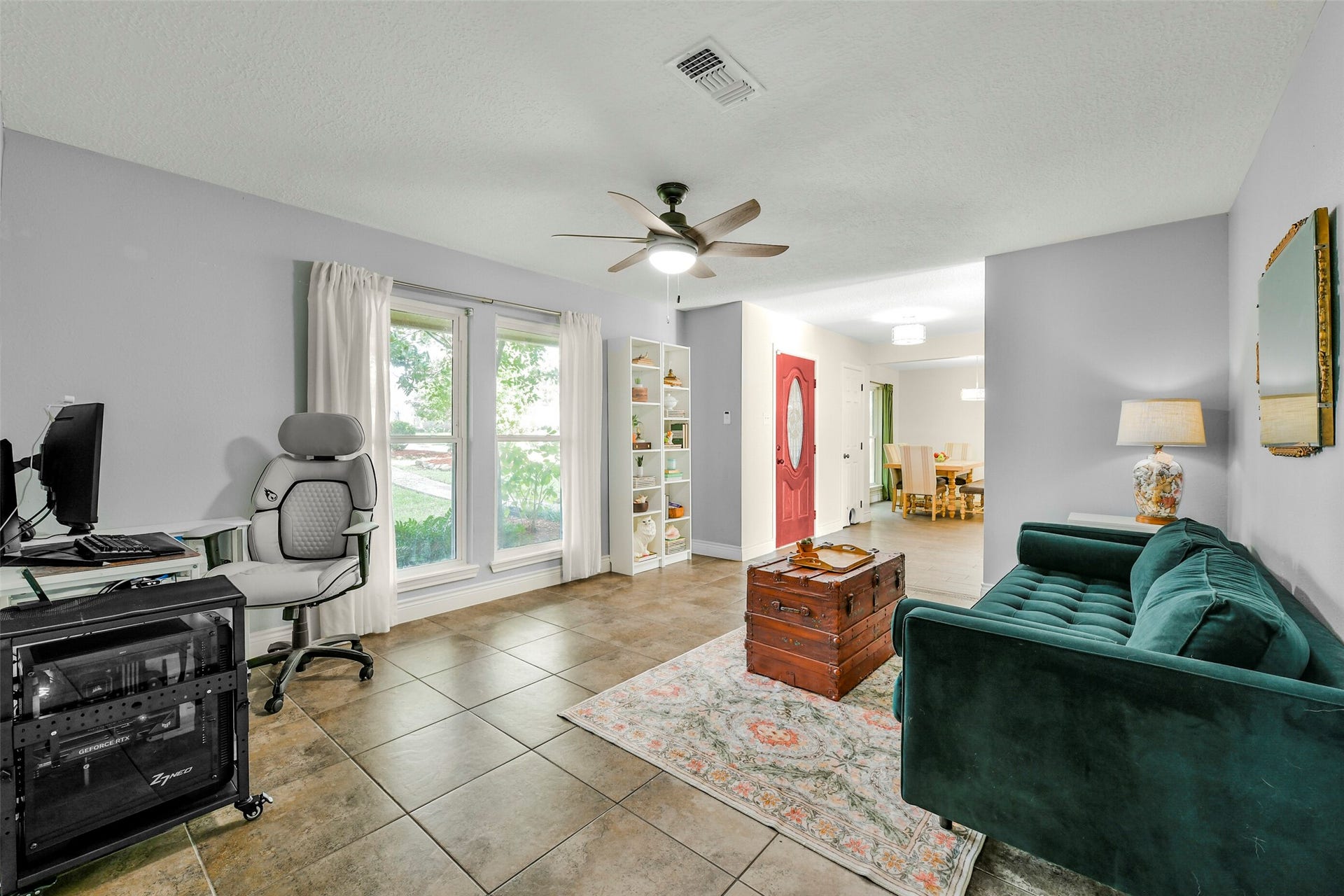 19611 Suncove Lane, Humble, TX 77346 Room for work, relaxation and a little creativity. Currently arranged as an office and sitting room, this versatile space pairs generous windows with an easy connection to the entry and dining area.