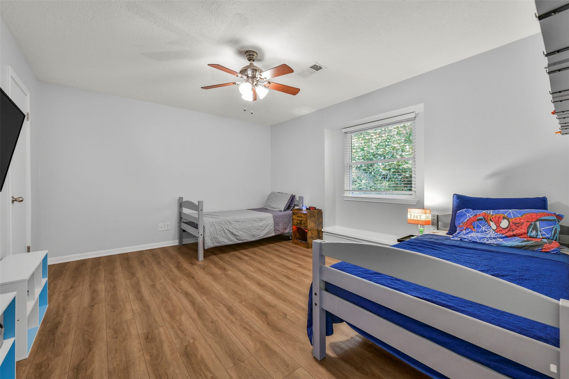 19611 Suncove Lane, Humble, TX 77346 A bedroom that gives you options. The spacious layout leaves room for multiple sleeping arrangements, a study area or additional storage, making it easy to adapt the space as your needs evolve.