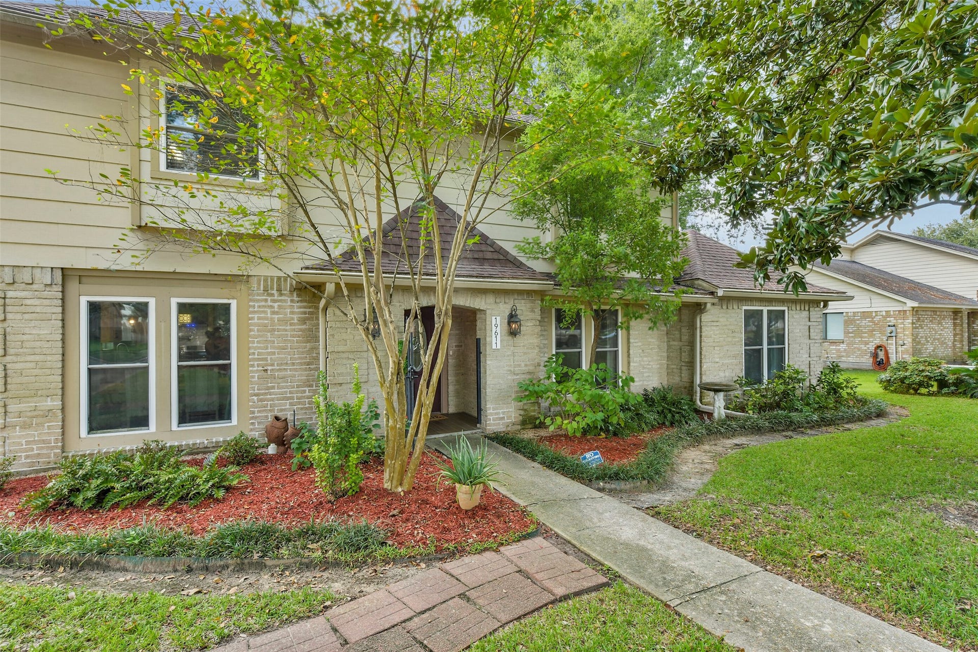19611 Suncove Lane, Humble, TX 77346 Follow the garden-lined walkway to an entrance full of personality. Layered landscaping, a sheltered doorway and a decorative glass front door set the tone for the warmth waiting inside.