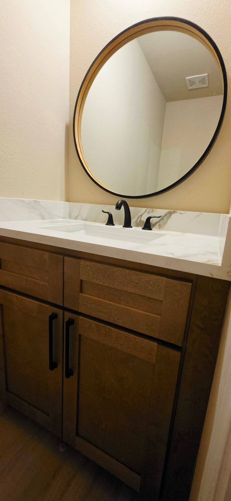 1402 Rodeo Cattle Lane, Houston, TX 77049 Half bathroom for your guests, features all wood cabinets