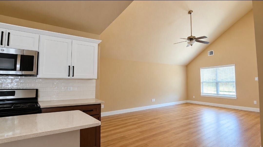 1402 Rodeo Cattle Lane, Houston, TX 77049 View of the living area from the kitchen features lots of natural light