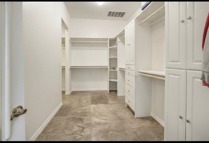 20547 Crosby Eastgate Road, Crosby, TX 77532 It takes two photos to see the entire primary closet.