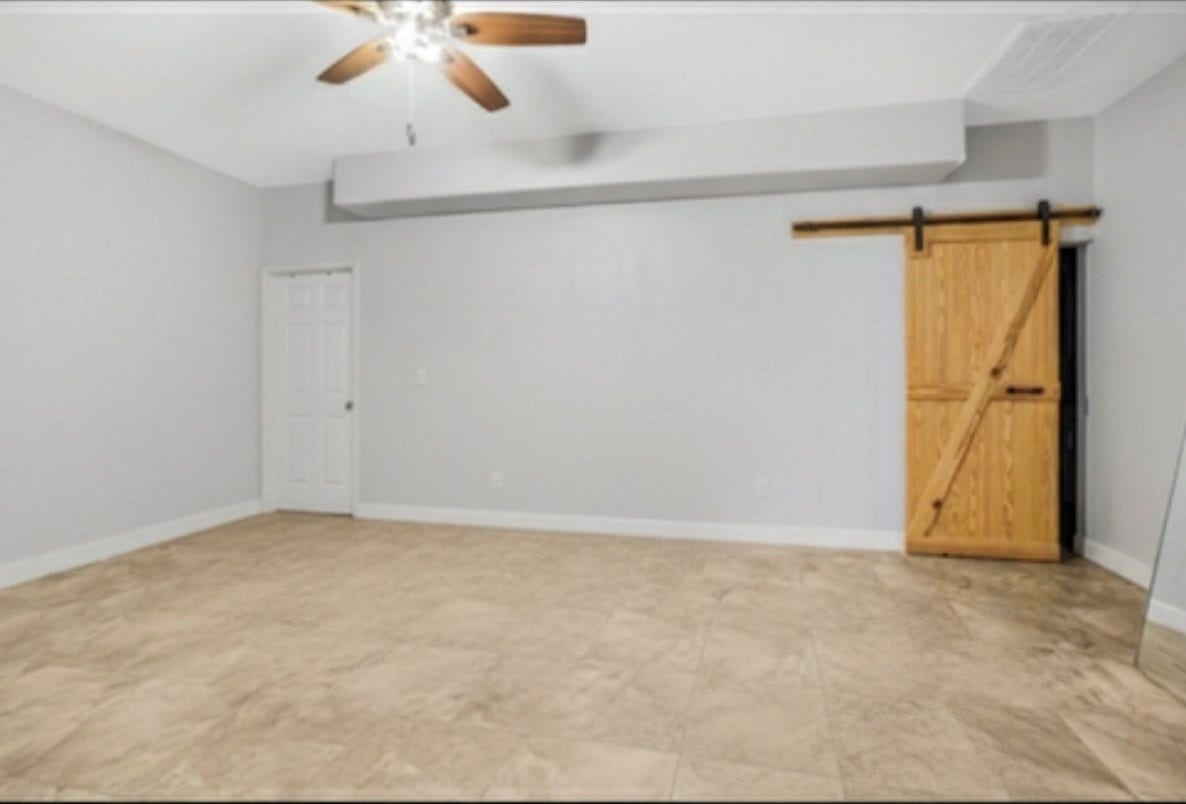20547 Crosby Eastgate Road, Crosby, TX 77532 Primary bedroom in the casita. Behind the barn door is the utility room. The enormous closet is behind the white door.