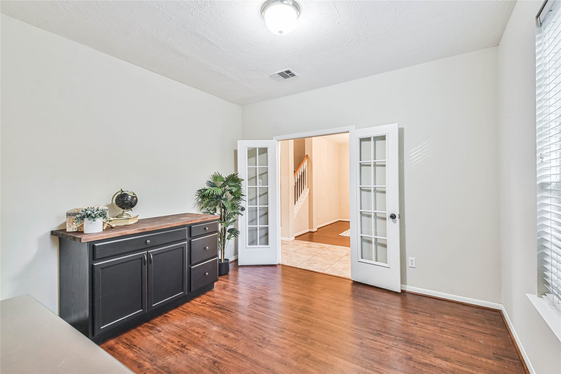 109 N Acacia Park Circle, The Woodlands, TX 77382 Dedicated home office with French doors just to the right of the entryway.