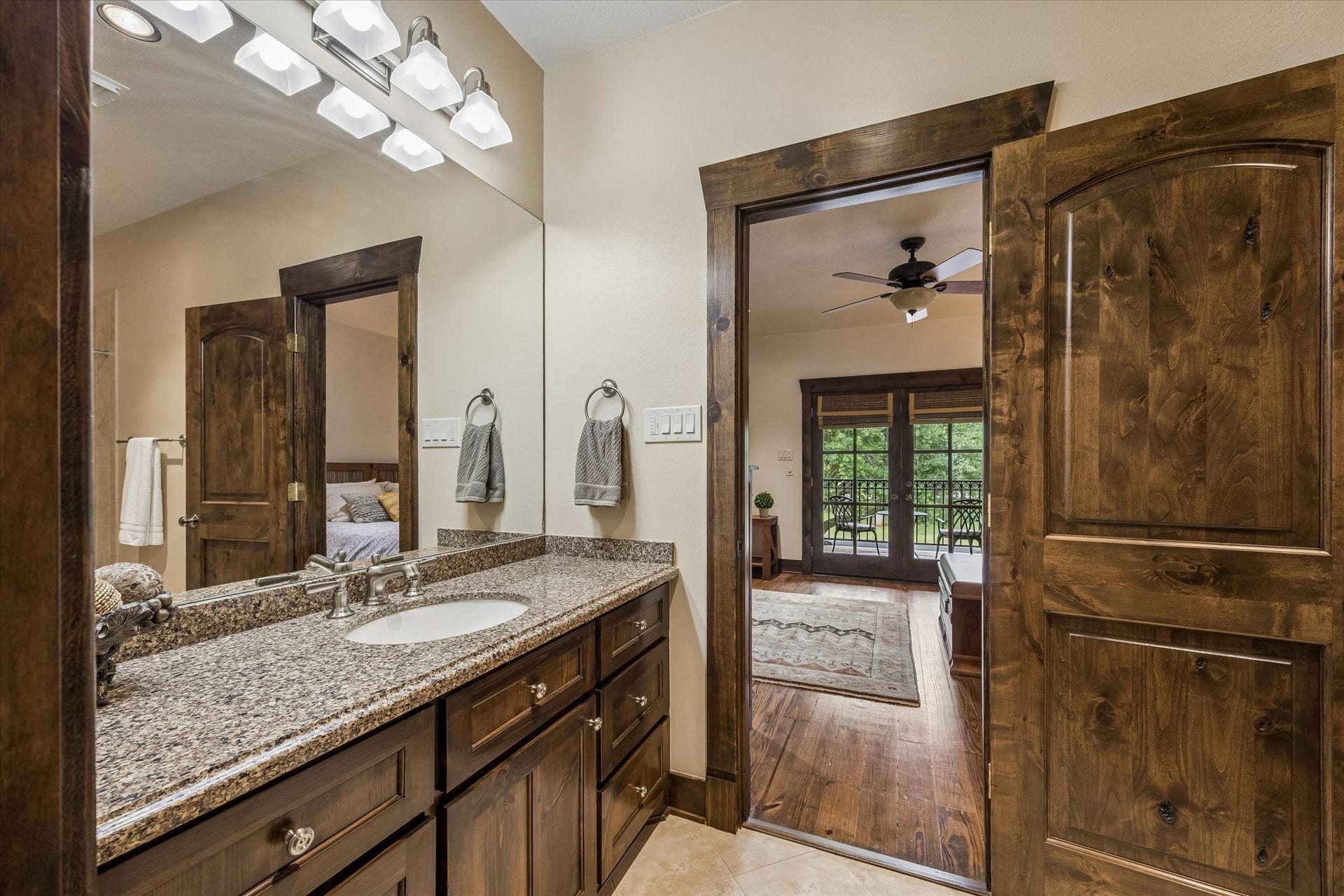 32102 Fulbrook Commons, Fulshear, TX 77441 Granite countertops, rich wood cabinetry, and direct bedroom access provide comfort and privacy for guests or family members. Bathroom is located upstairs off the bonus room. Has a large walk in closet as well, not shown.