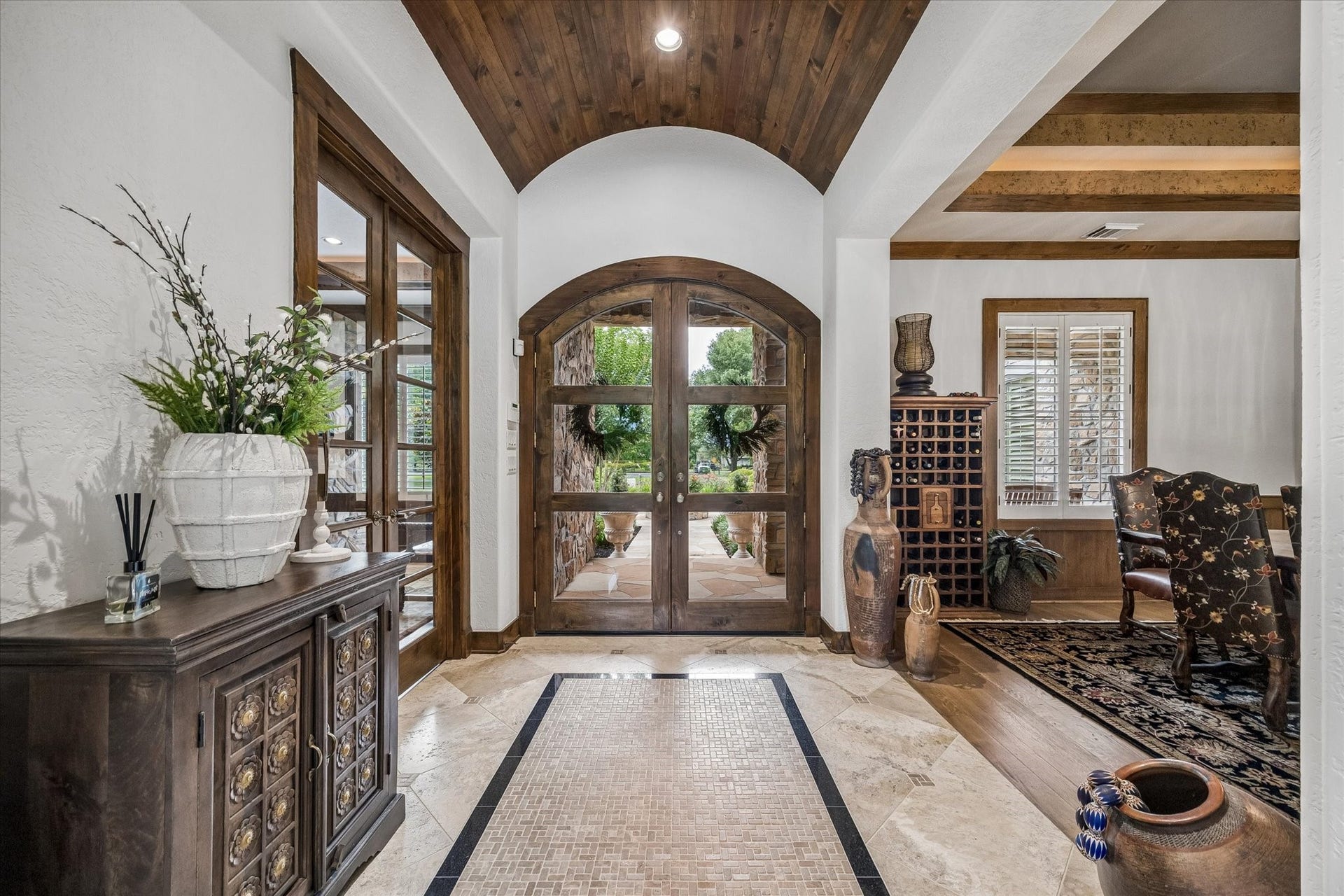 32102 Fulbrook Commons, Fulshear, TX 77441 The impressive foyer welcomes guests with soaring ceilings, rich wood accents, and elegant architectural details. Stunning entryway!