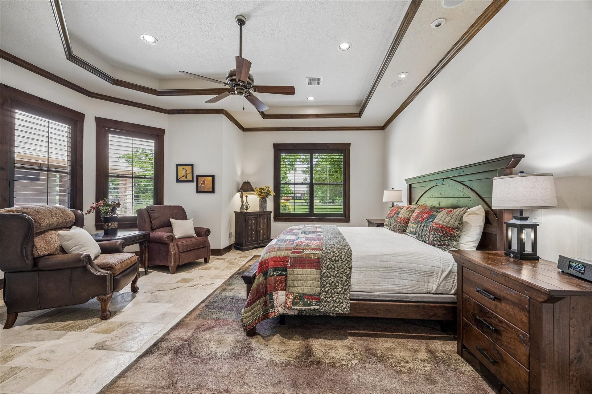 32102 Fulbrook Commons, Fulshear, TX 77441 Large windows invite natural light indoors while creating a bright and relaxing atmosphere throughout the room.