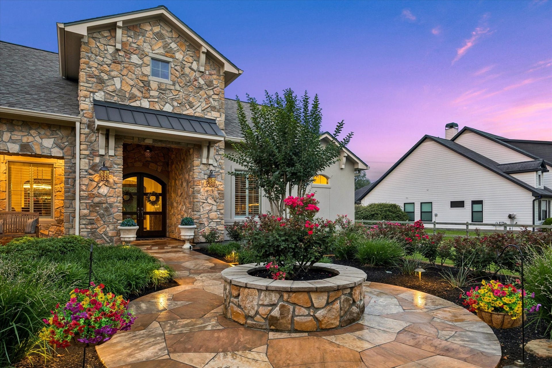 32102 Fulbrook Commons, Fulshear, TX 77441 A winding flagstone approach leads through the vibrant garden to a welcoming covered entry.
