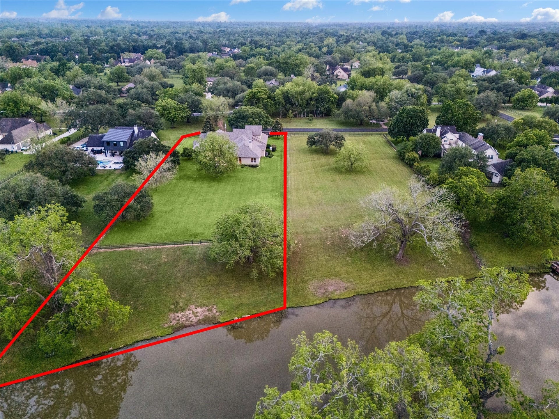 32102 Fulbrook Commons, Fulshear, TX 77441 The adjoining 1.3-acre lot and this 1.5-story home are both available
for sale and may be purchased together.