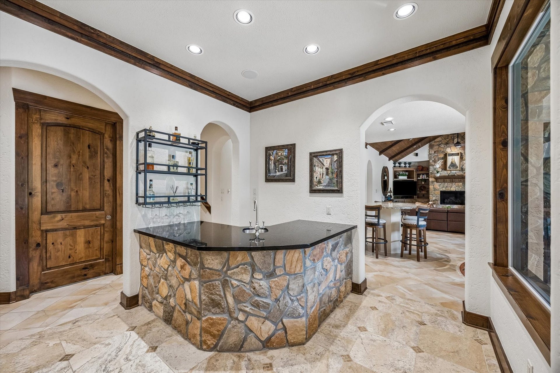 32102 Fulbrook Commons, Fulshear, TX 77441 Perfectly positioned, the wet bar adds convenience and sophistication for hosting family and friends.