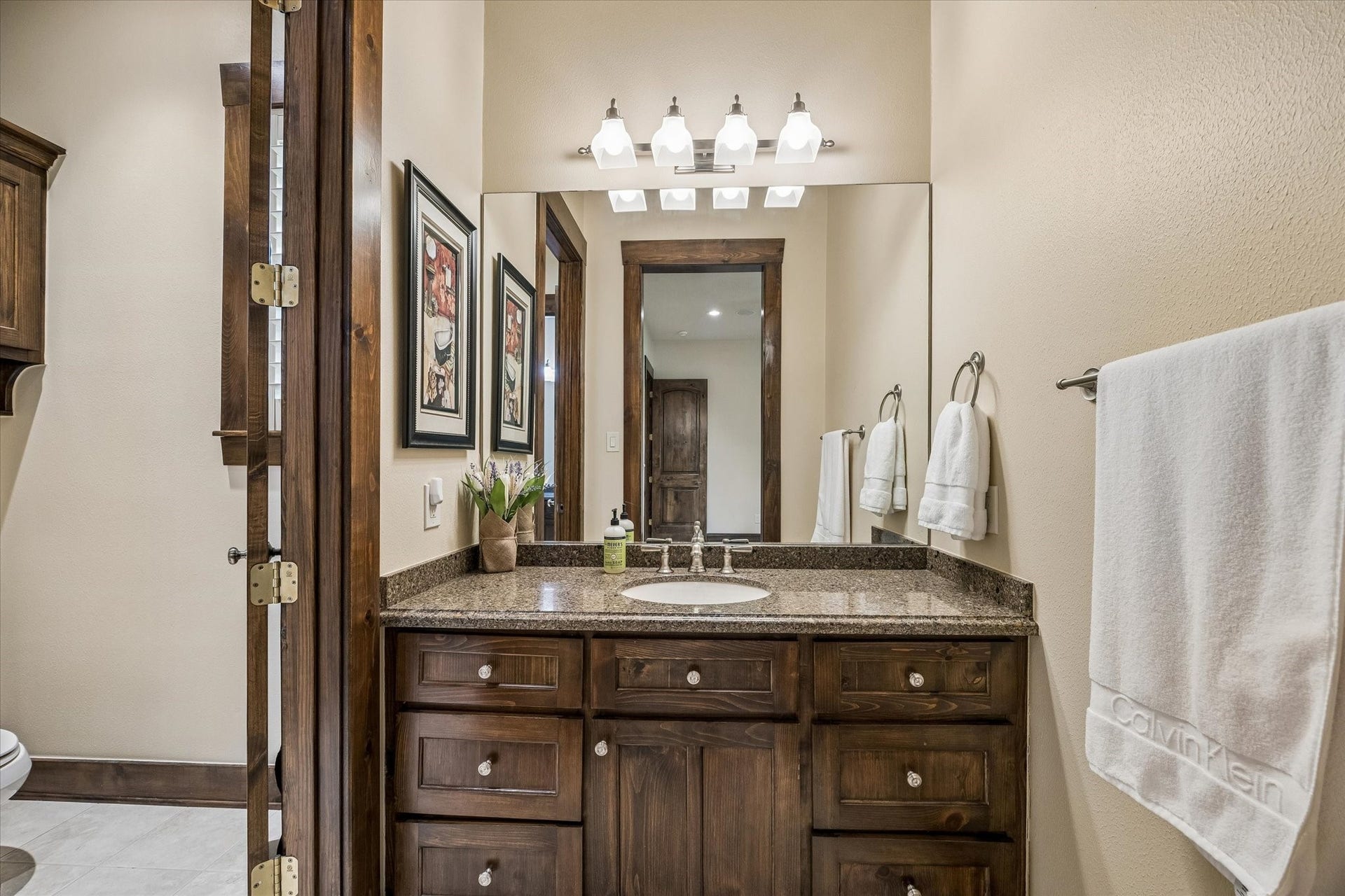 32102 Fulbrook Commons, Fulshear, TX 77441 Well-appointed with quality finishes, this bathroom offers convenience and comfort for guests and residents alike.