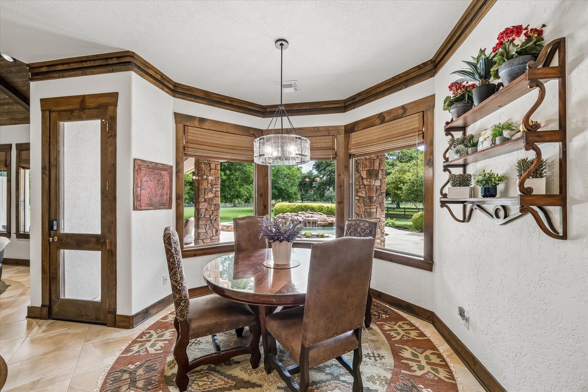 32102 Fulbrook Commons, Fulshear, TX 77441 Surrounded by backyard views, the breakfast area offers a bright and inviting place to start the day.