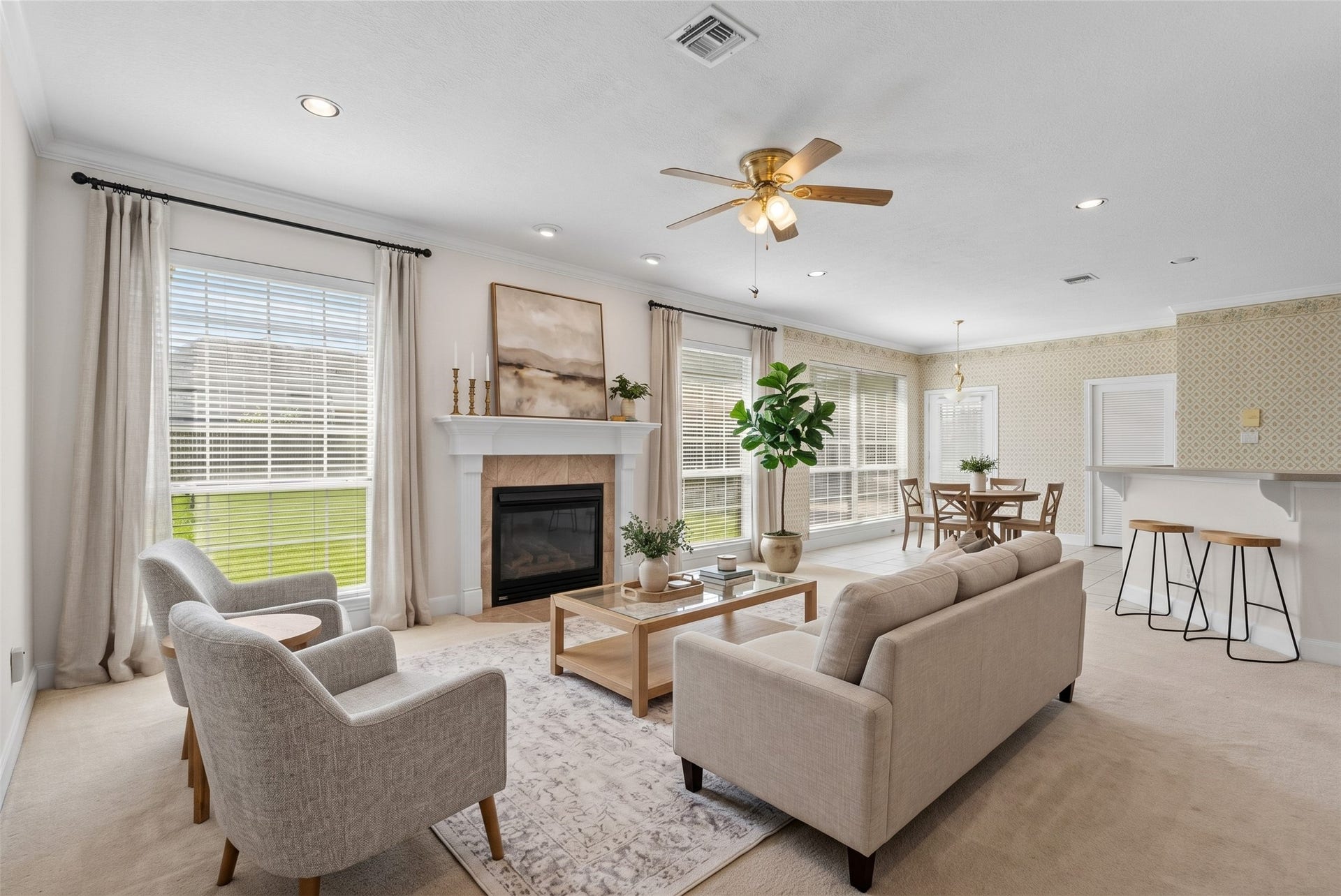 4402 Santee Drive, Baytown, TX 77521 Generous natural light pours through a wall of oversized windows, making this expansive 17x21 living room feel bright and inviting throughout the day.