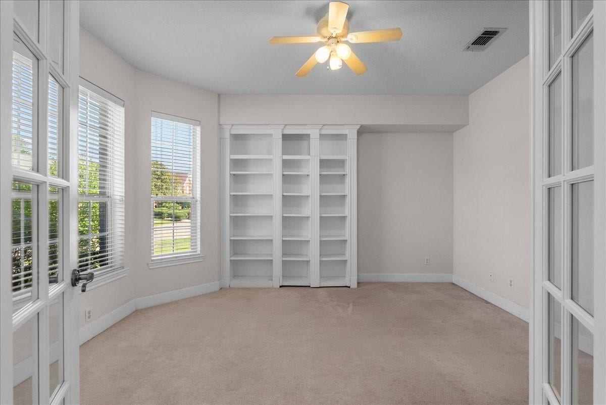 4402 Santee Drive, Baytown, TX 77521 Expansive bay windows fill this private study with energizing natural light.