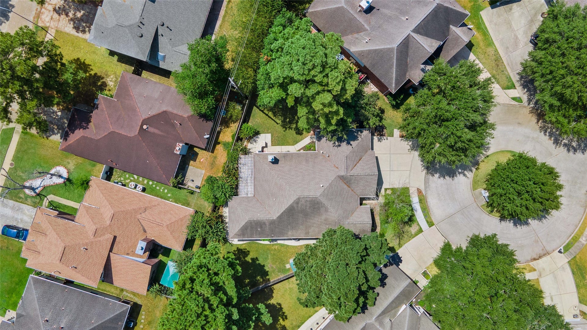 16503 Oat Mill Drive, Houston, TX 77095 Your new home is in the center of this photo which shows the house flanked by trees on both fence lines and the cul-de-sac on the right.