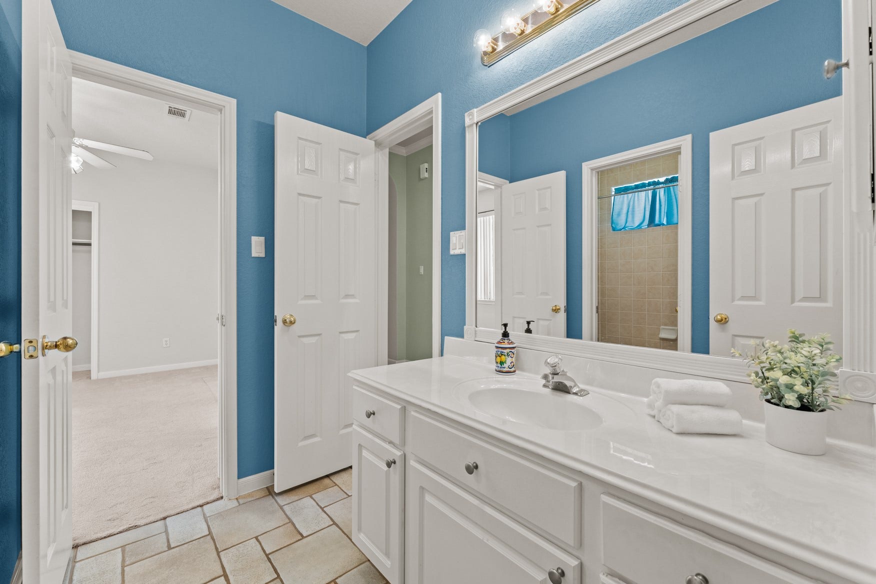16503 Oat Mill Drive, Houston, TX 77095 This fun, vibrant bathroom features a vanity area that is separate from the shower/tub area, making morning prep easier and more efficient!
