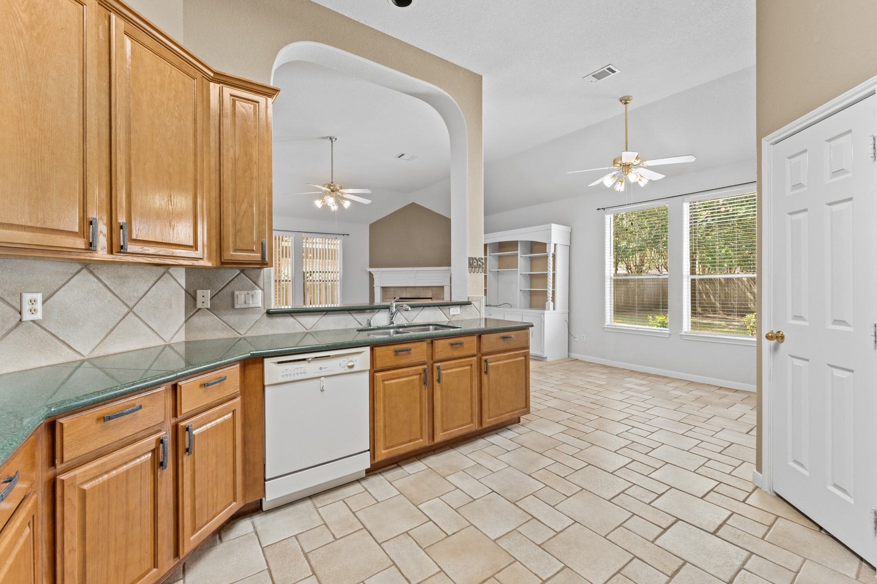 16503 Oat Mill Drive, Houston, TX 77095 This large kitchen is open to the breakfast area and includes a LONG COUNTER - great for meal prep - and a WALK-IN PANTRY!