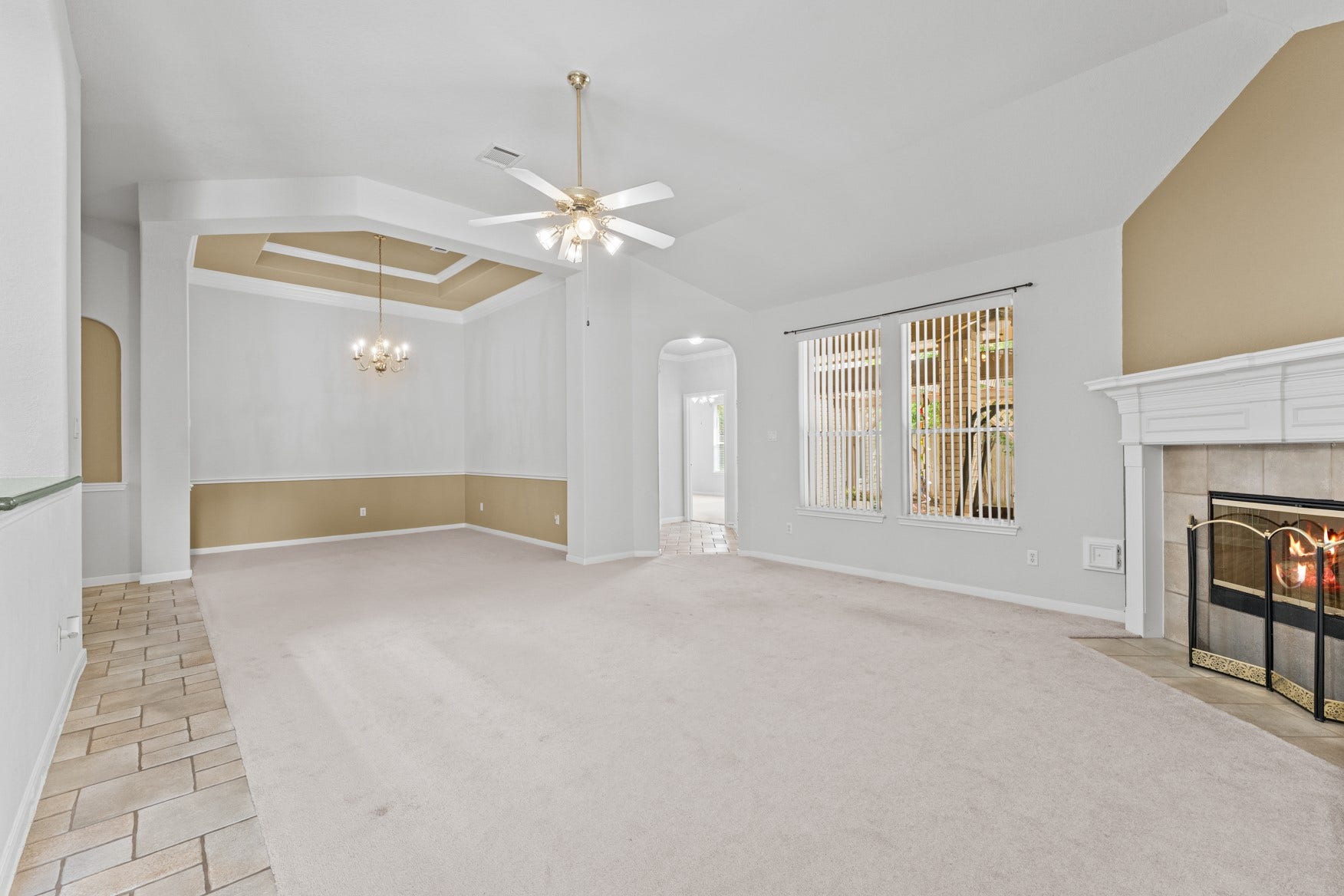 16503 Oat Mill Drive, Houston, TX 77095 Smooth transition between the living and dining areas makes this space great for gatherings! The hallway right of center provides access to the back patio and to the primary suite.