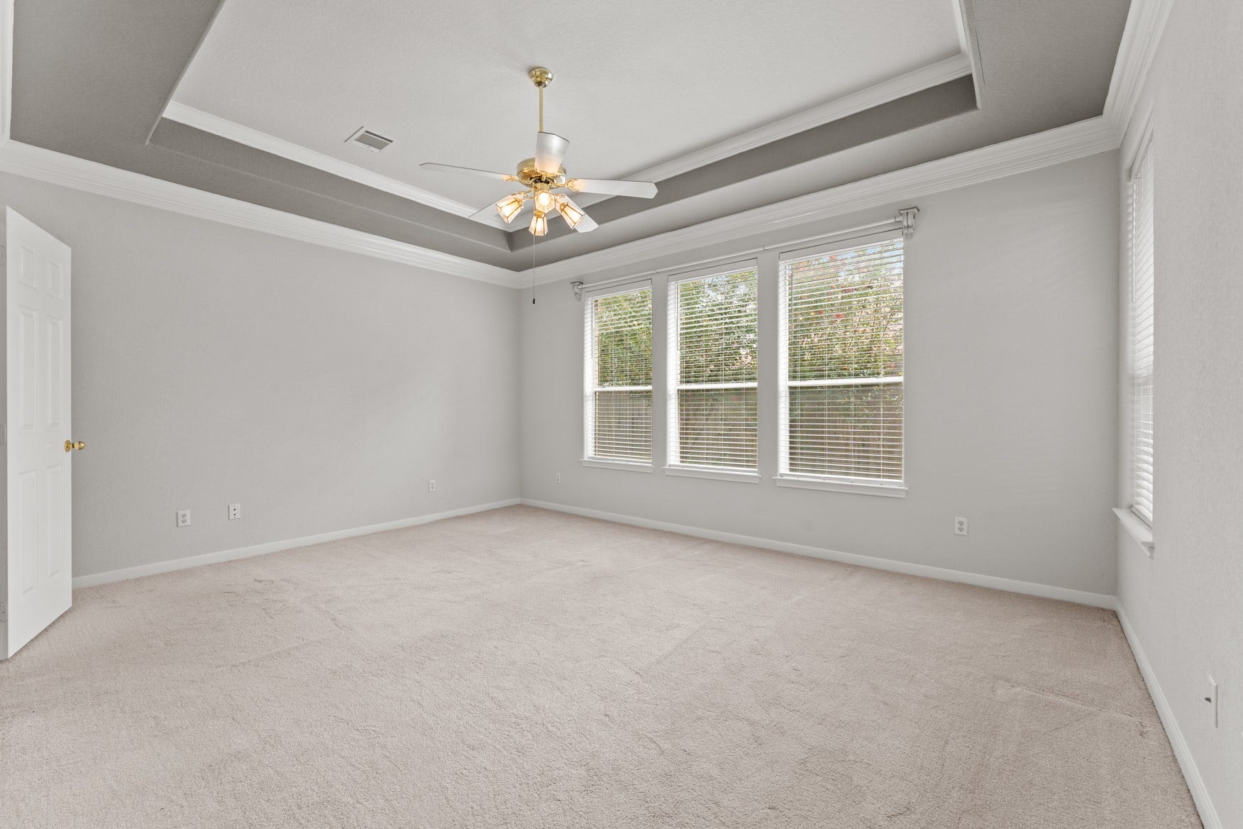16503 Oat Mill Drive, Houston, TX 77095 This primary suite is a true private retreat! The tray ceiling and elegant crown molding help create a luxurious feel to the space.