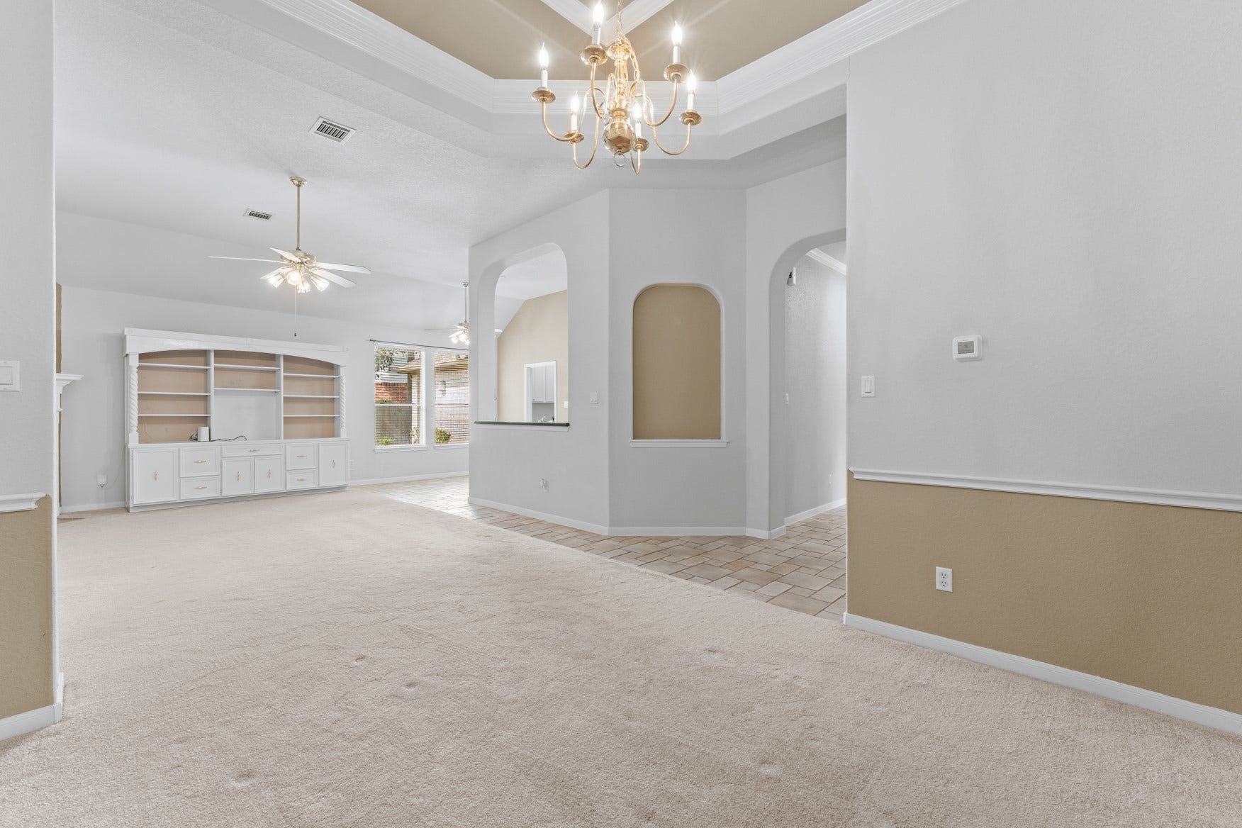 16503 Oat Mill Drive, Houston, TX 77095 Open, spacious areas make it easy to gather with family and friends! View from the dining area looking towards the living room, kitchen, and breakfast area.