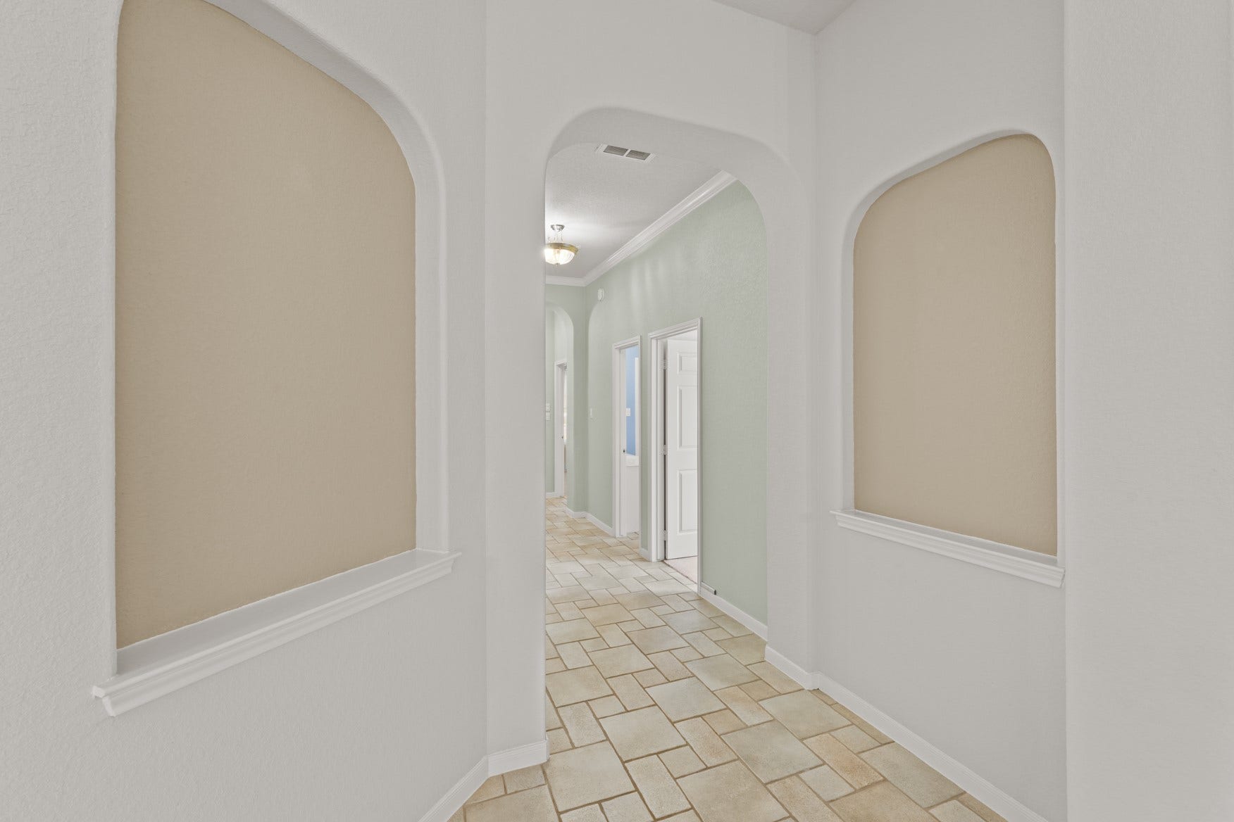16503 Oat Mill Drive, Houston, TX 77095 Art niches and and arched pass-throughs give this home architectural interest!