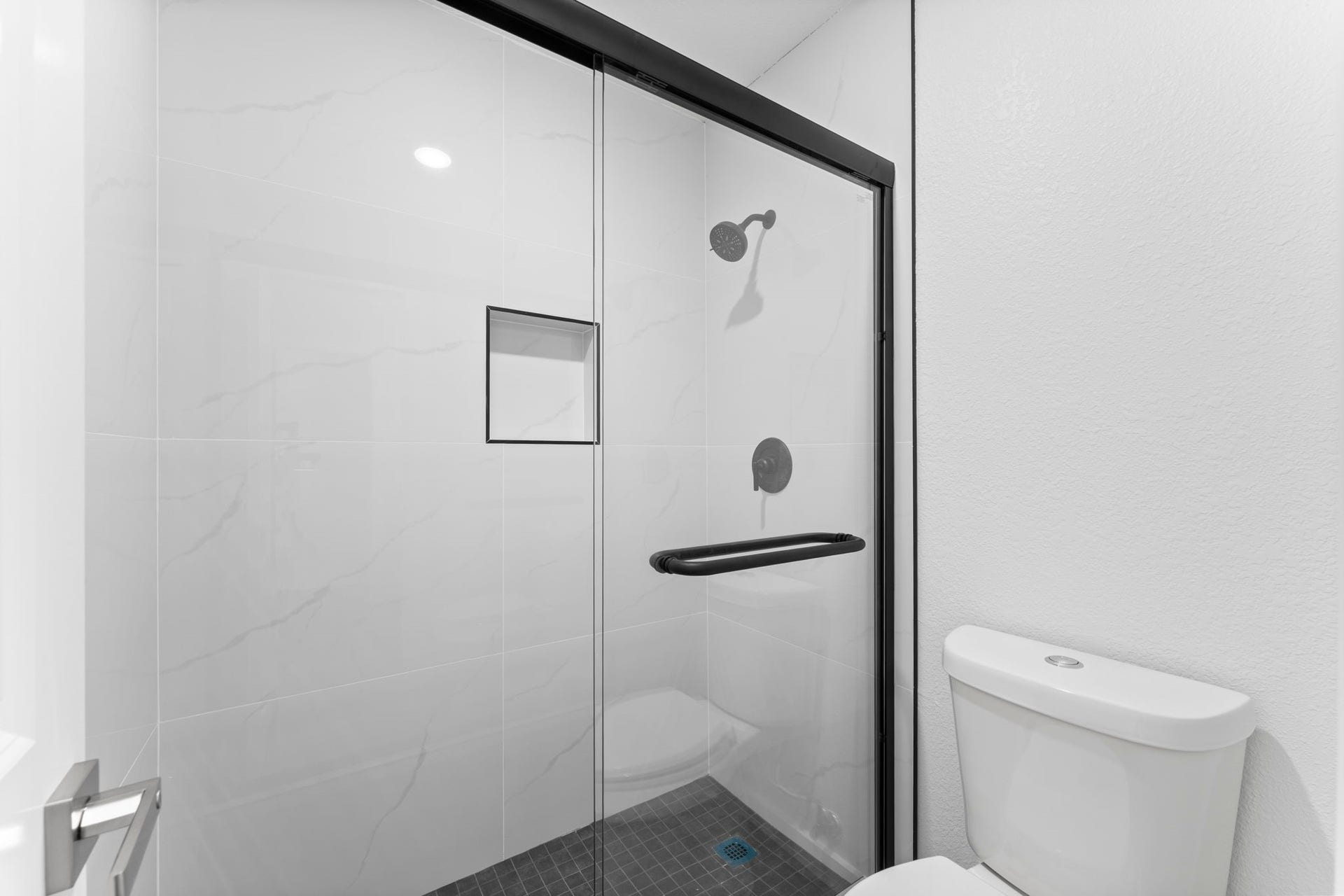 2230 Fresh Flower Way, Richmond, TX 77406 This secondary shower features stunning full-height tile work and a designer rainfall showerhead.