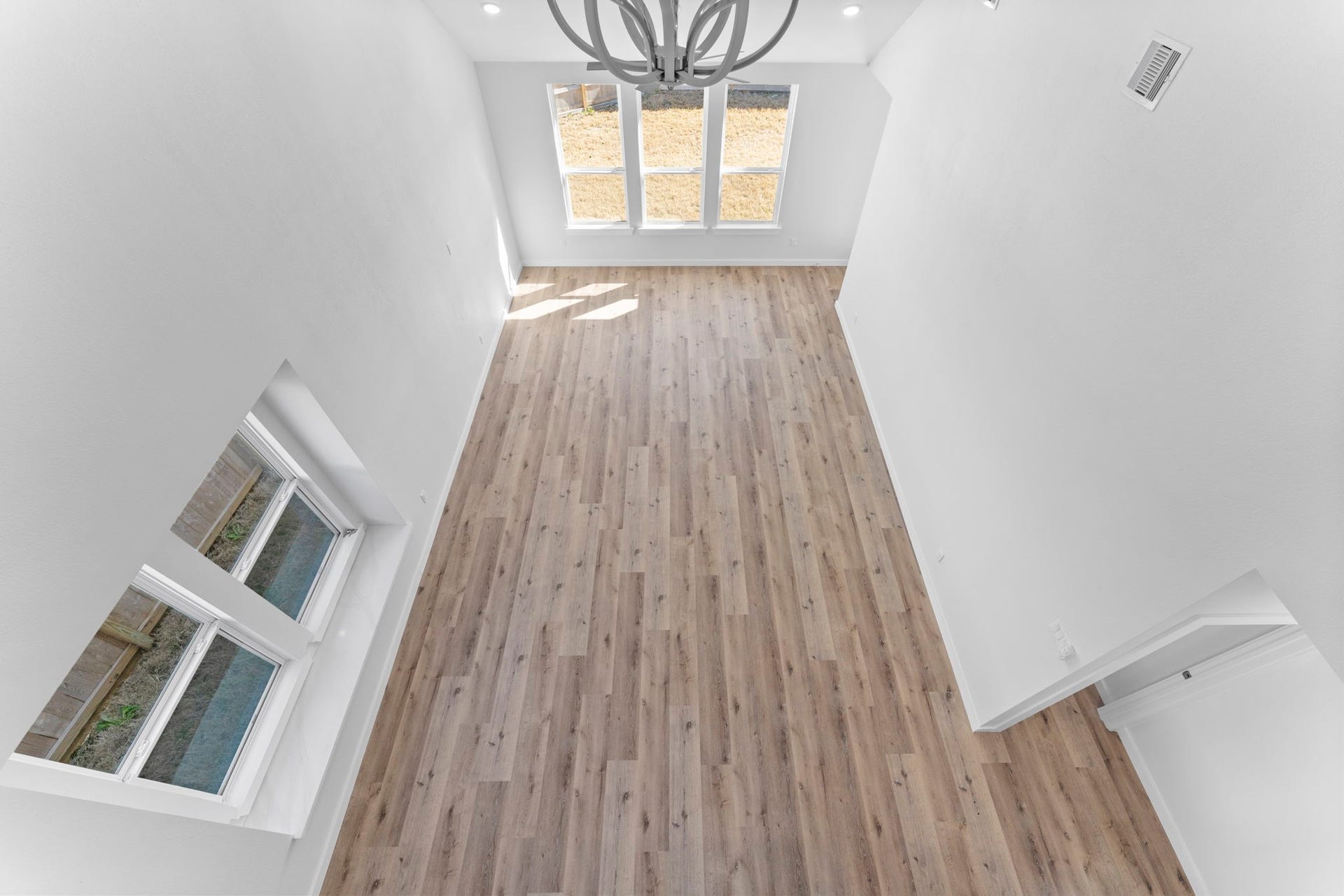 2230 Fresh Flower Way, Richmond, TX 77406 Looking down from the game room provides a unique view of the incredible scale and natural light that defines this home.