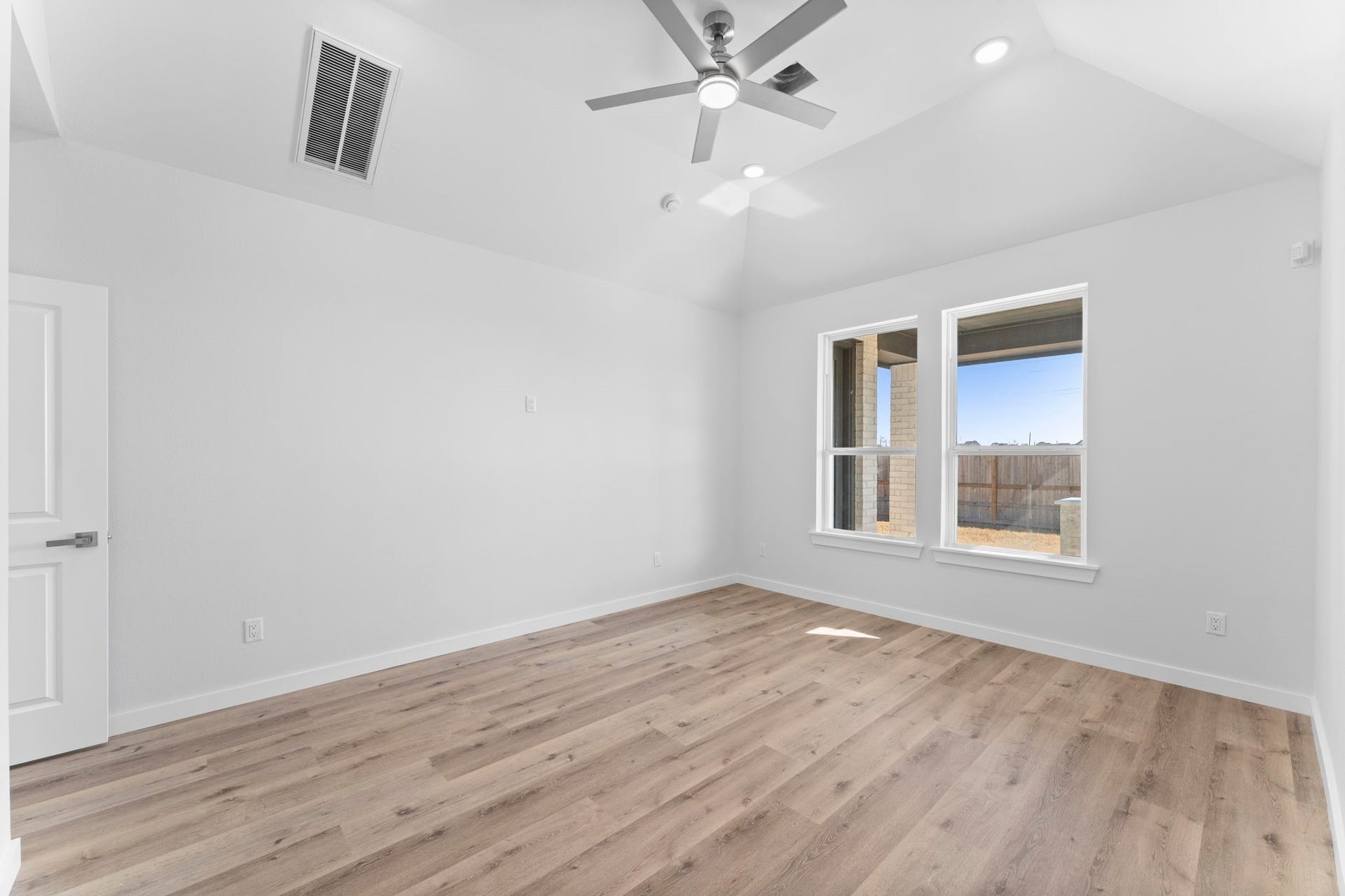 2230 Fresh Flower Way, Richmond, TX 77406 Vaulted high ceilings, and oversized windows which let in a lot of natural light.