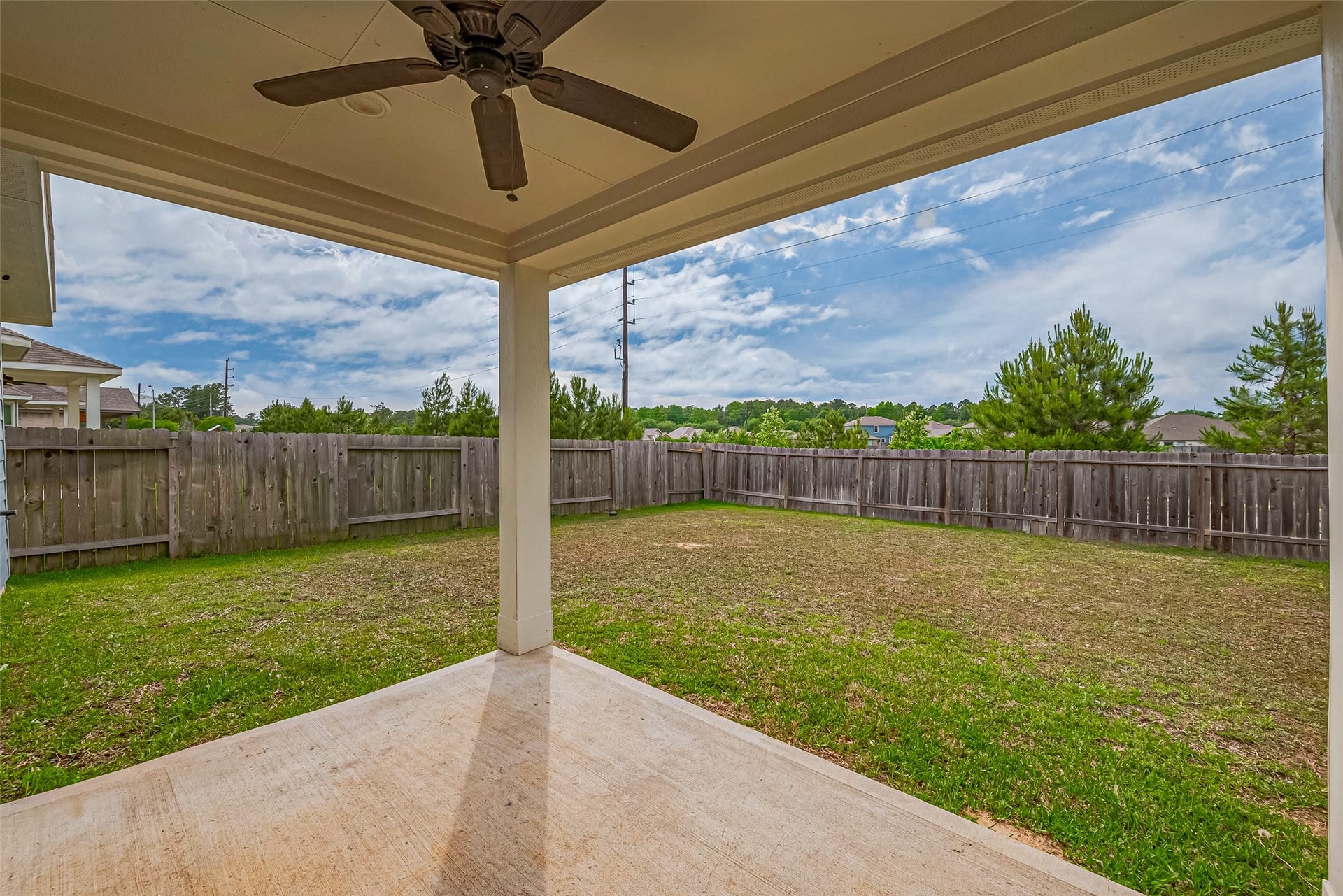 335 Jewett Meadow Drive, Magnolia, TX 77354 Beat the heat on the covered patio with fan!
