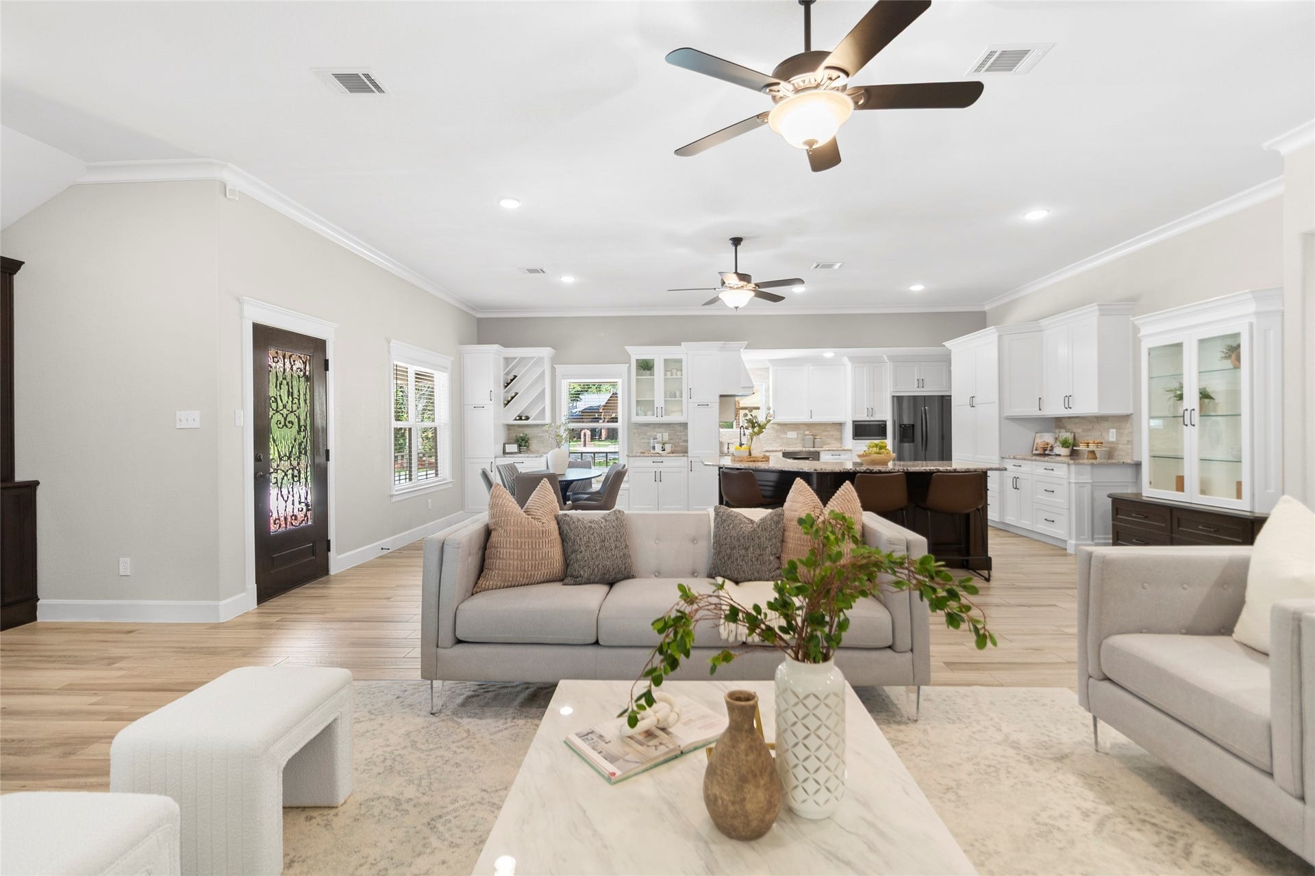 Your living room offers the perfect blend of comfort and style with soaring ceilings, recessed lighting, and an airy layout that makes the entire home feel connected.