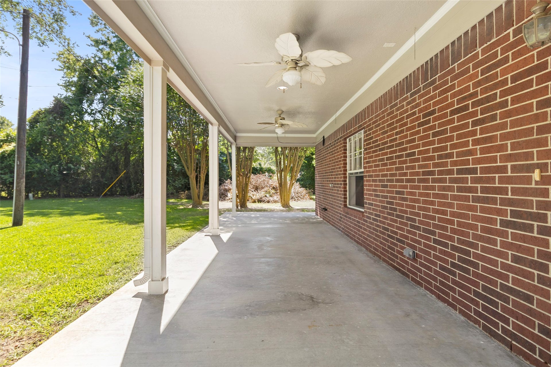 Relax beneath your oversized covered patio complete with ceiling fans & plenty of space for outdoor dining, lounging, and year-round entertaining.
