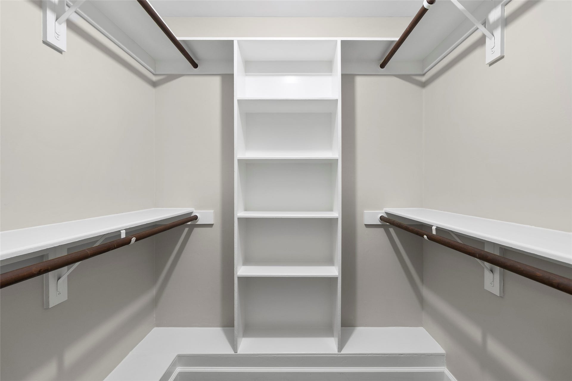 Everything has its place in your oversized walk-in closet complete with built-in shelving, double hanging space, and easy everyday organization.