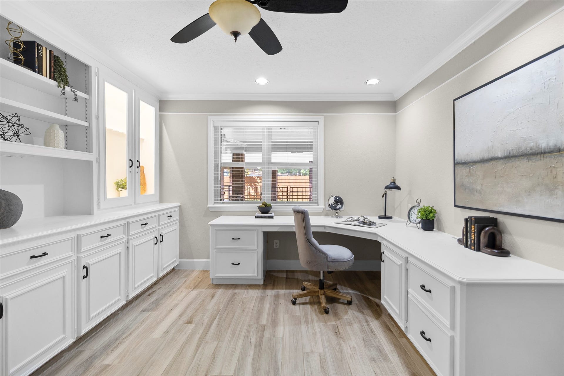 Working from home feels elevated in your custom office space featuring expansive built-ins, abundant storage, and a bright workspace designed to keep everything beautifully organized.