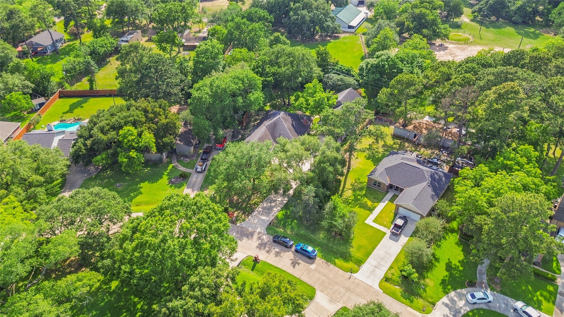 From above, you can see how beautifully your home sits within this established neighborhood filled with oversized lots, greenery, & natural privacy.
