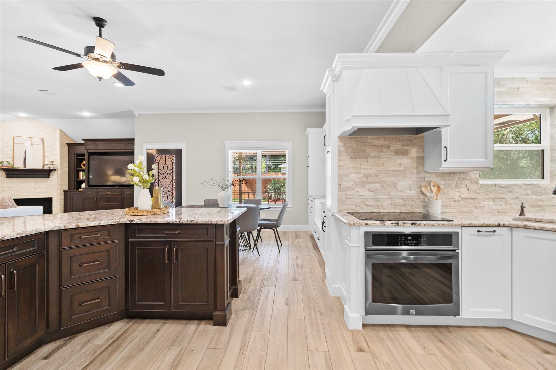 Your open-concept kitchen keeps everyone connected, whether youre preparing dinner at the oversized island or entertaining guests flowing effortlessly between the living and dining spaces.