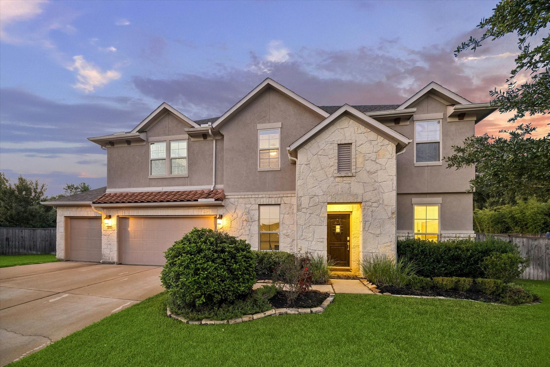 20338 Sienna Bluff Drive, Cypress, TX 77433 Gorgeous stucco and stone elevation with extensive landscaping to perfection.
