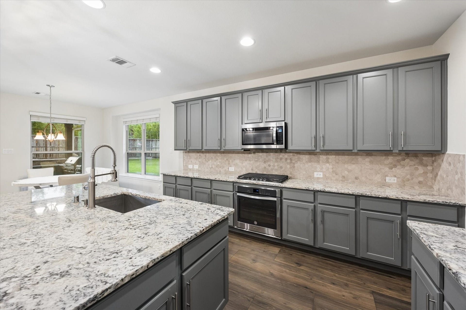 20338 Sienna Bluff Drive, Cypress, TX 77433 Open-concept kitchen create a bright, functional space with ample room for meal preparation and entertaining.
