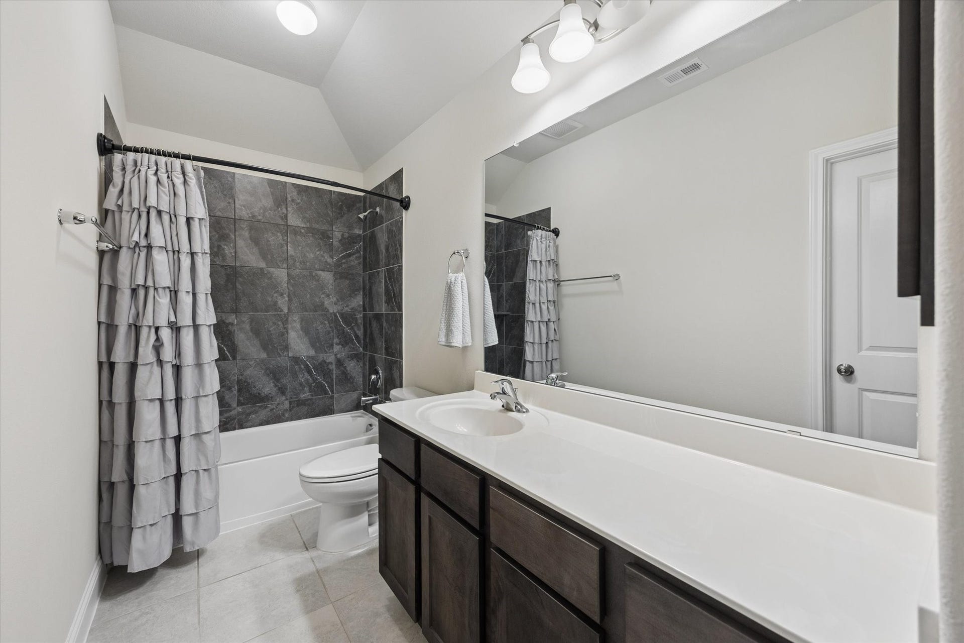 20338 Sienna Bluff Drive, Cypress, TX 77433 Private bathroom adjoined to secondary bedroom with plenty of a cabinetry and vanity room.