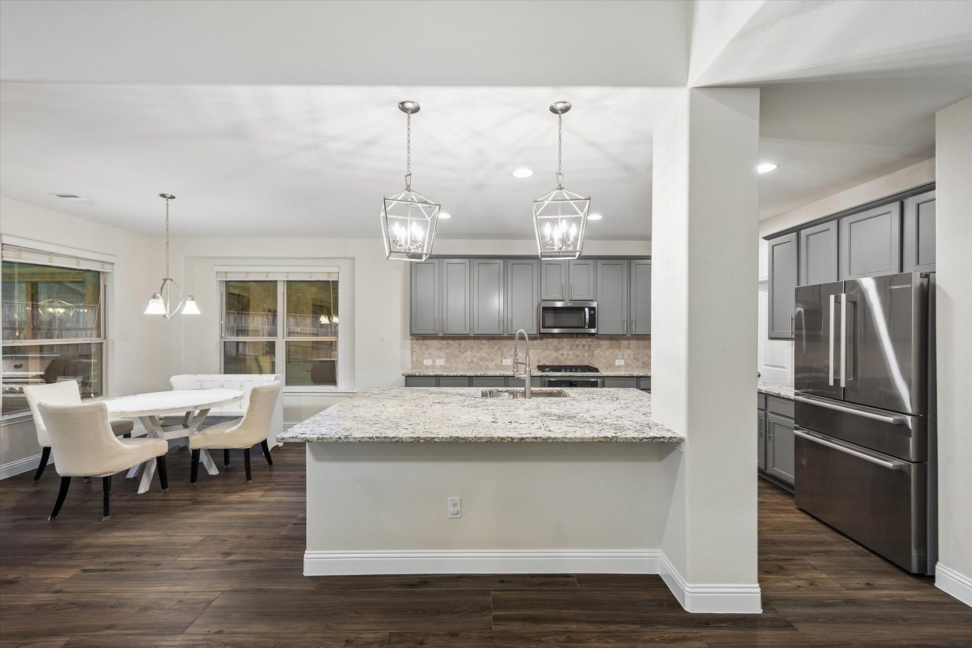 20338 Sienna Bluff Drive, Cypress, TX 77433 Large, centered island with plenty of cabinets for storage. Not to mention a HUGE pantry size.