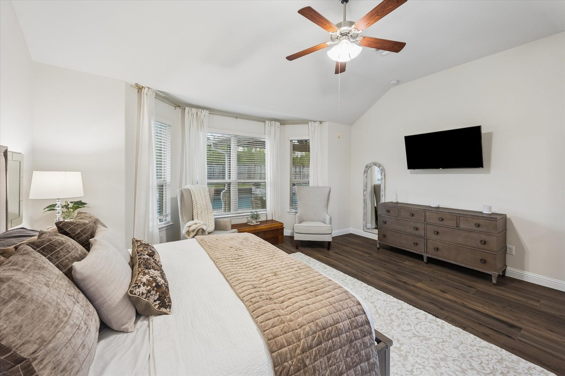 20338 Sienna Bluff Drive, Cypress, TX 77433 Beautiful bay of windows with stylish window treatment offers views of the backyard and pool area; the perfect spot to relax.
