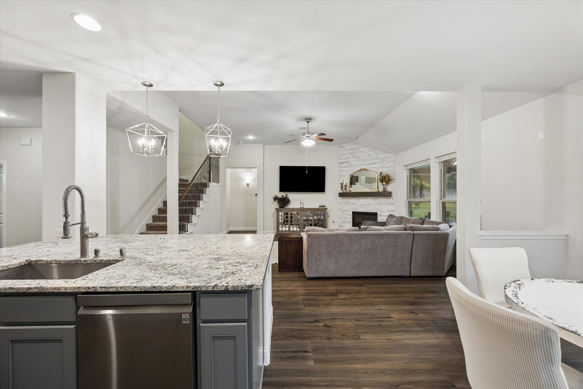 20338 Sienna Bluff Drive, Cypress, TX 77433 The kitchen flows effortlessly into the breakfast area and living spaces, creating a functional entertaining space.