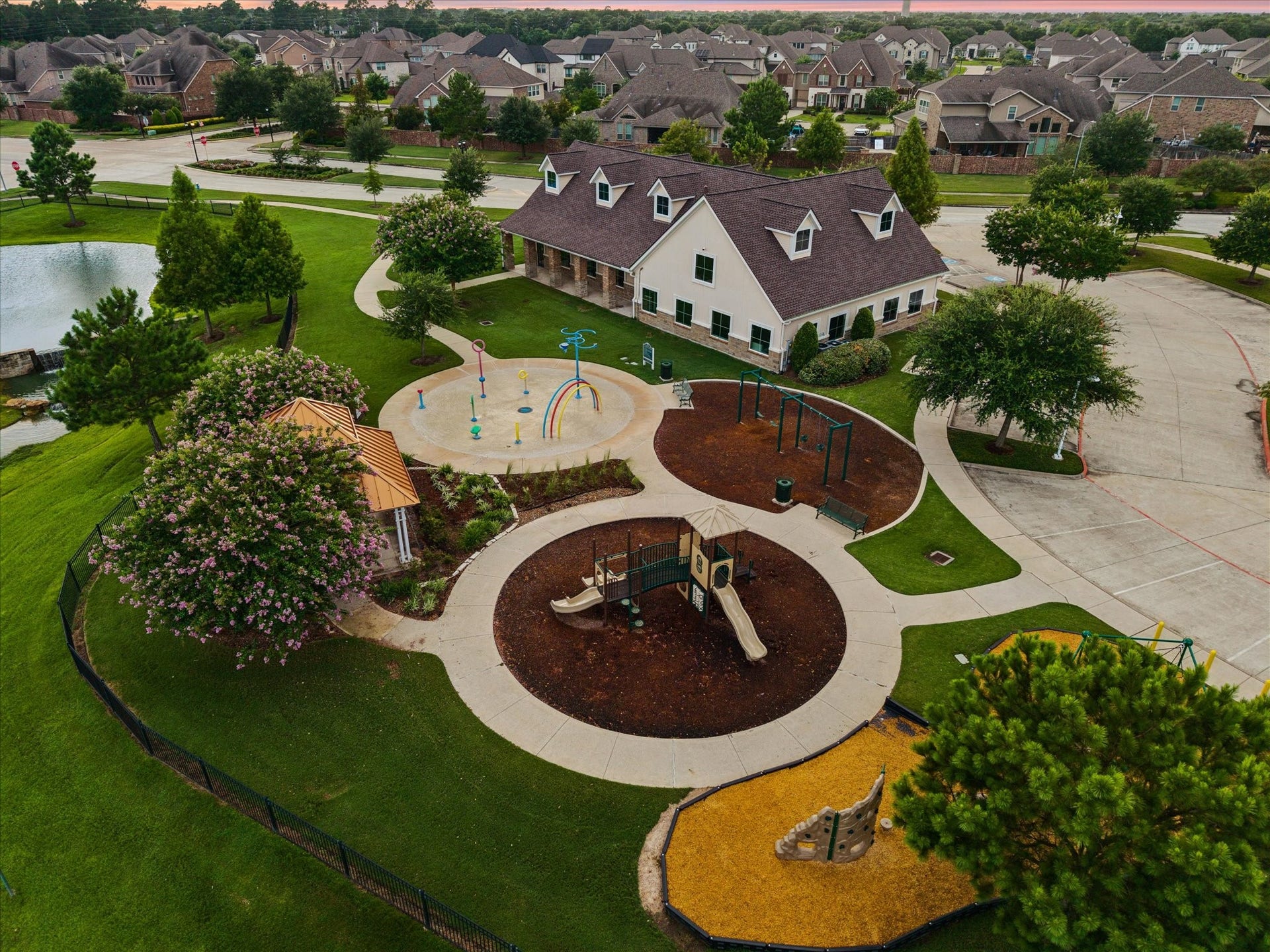 20338 Sienna Bluff Drive, Cypress, TX 77433 This aerial perspective showcases the communitys inviting layout, scenic ponds, winding streets, and expansive landscaped areas, creating a peaceful setting with a welcoming neighborhood feel.