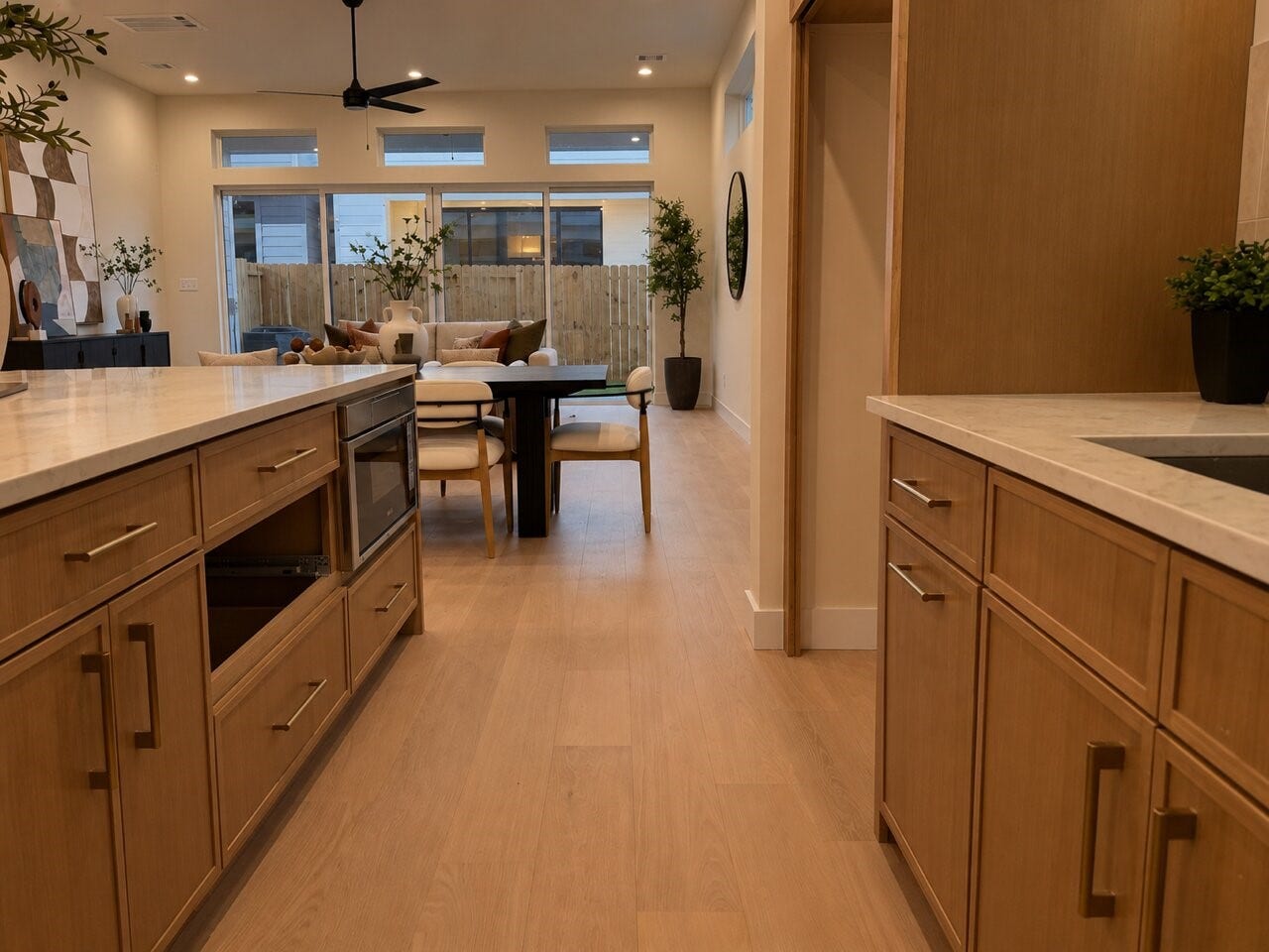 1122 Robbie Street, Houston, TX 77009 This home's kitchen comes with Taj Mahal counters, oversized island with storage on both sides, white oak slim shaker cabinetry, luxury Bosch appliances, Delta champagne bronze fixtures, and white oak wood flooring.