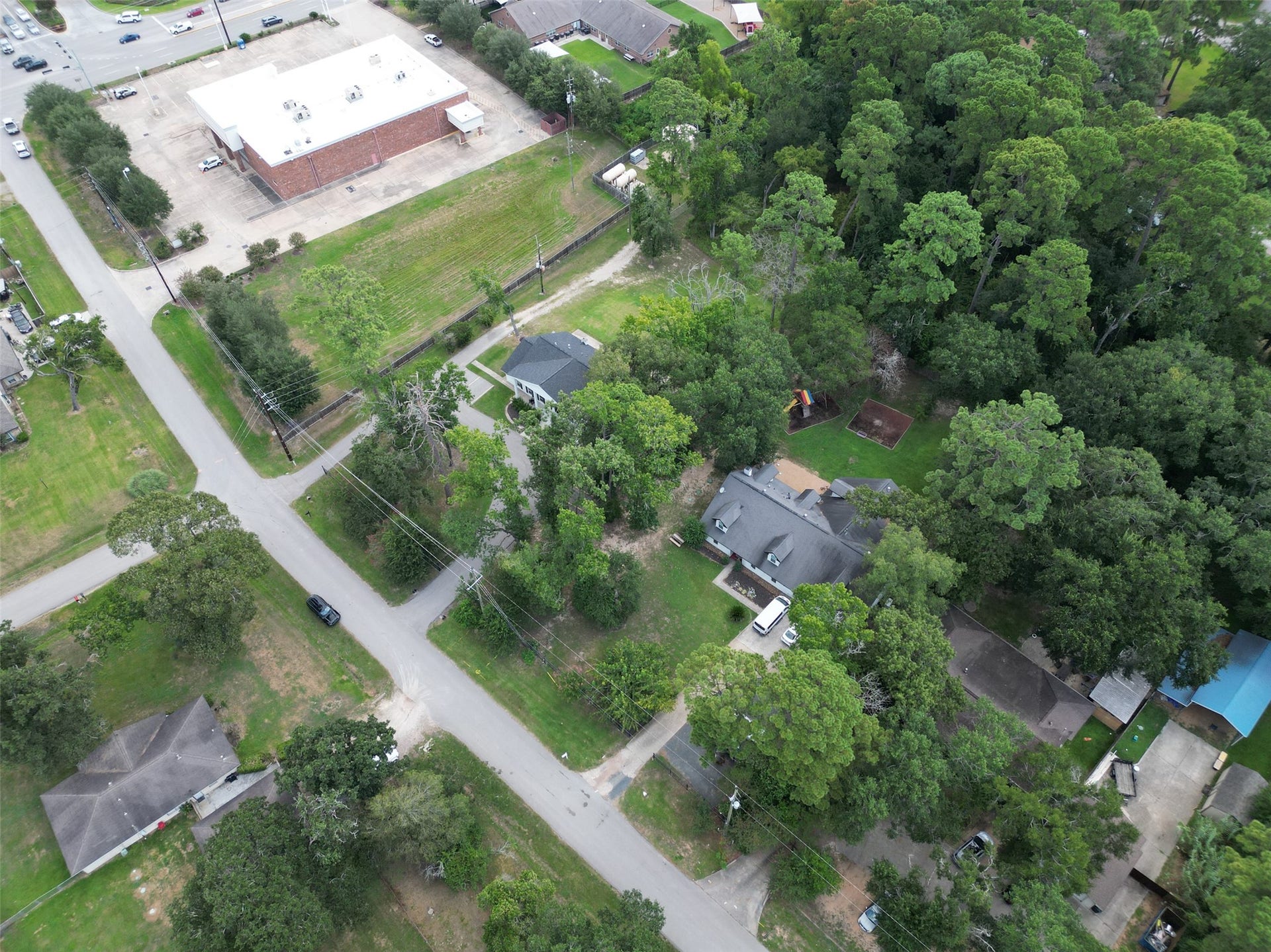 29902 E Hawthorne Drive, Spring, TX 77386 Ideally set and used in the past as group home campus offers short cut to licensing, or convert to unique needs of a new buyer. Homes sit in a mixed use community.