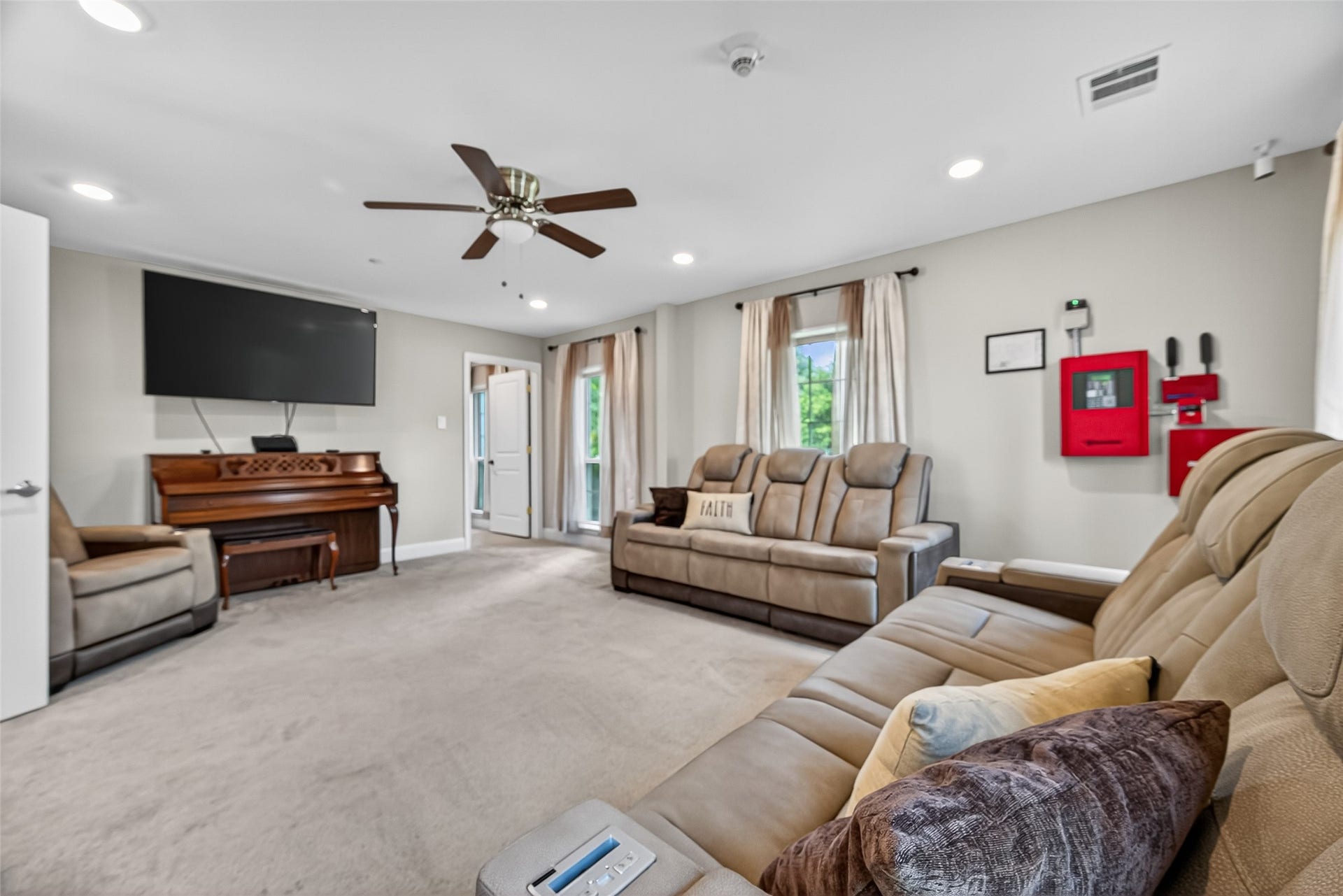 29902 E Hawthorne Drive, Spring, TX 77386 29902-Living room showing fire equipment on wall.