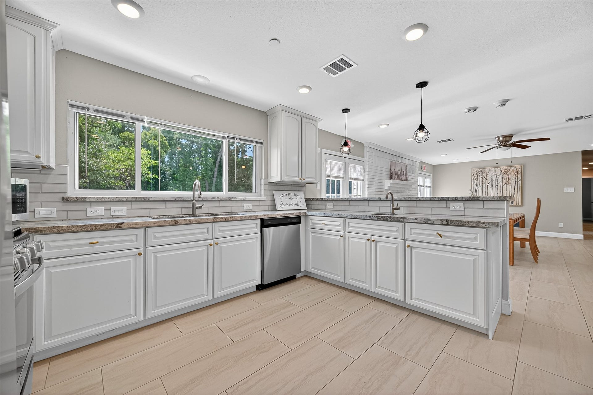 29902 E Hawthorne Drive, Spring, TX 77386 29902-View from kitchen to dining area. Two sets of French doors to rear of property with the one closest to kitchen providing a wheel chair ramp.