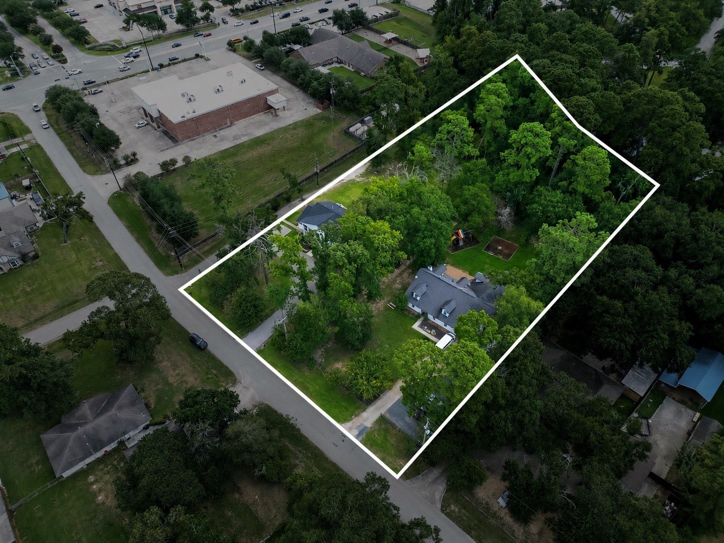 29902 E Hawthorne Drive, Spring, TX 77386 Commercial or Residential two home property with almost 2 acres of wooded grounds. Listing price is for both homes selling as a package deal. Two separate tax ID numbers and addresses include 29902 E Hawthorne (colonial style white home) and 29818 E Hawthorne (Brick ranch style home)