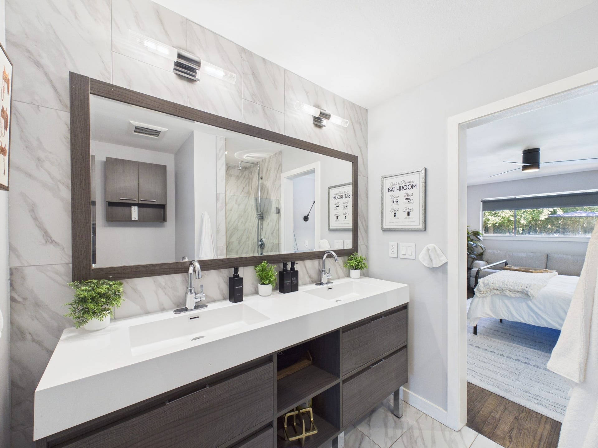 Beautiful Primary Bath with Wall to Floor Porcelain Marble Tile & Dual Vanity