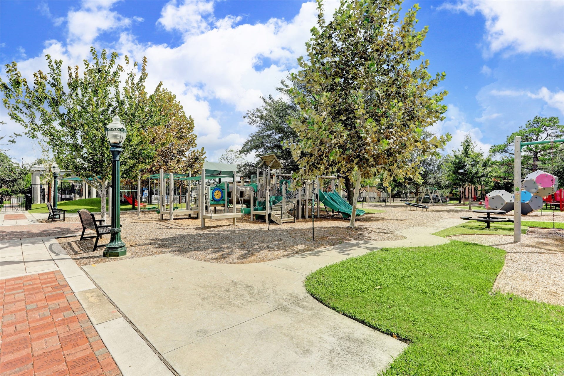 11 Southside Circle, Southside Place, TX 77025 The neighborhood park featuring a playful fire truck theme, inviting green spaces, and a welcoming setting for families.