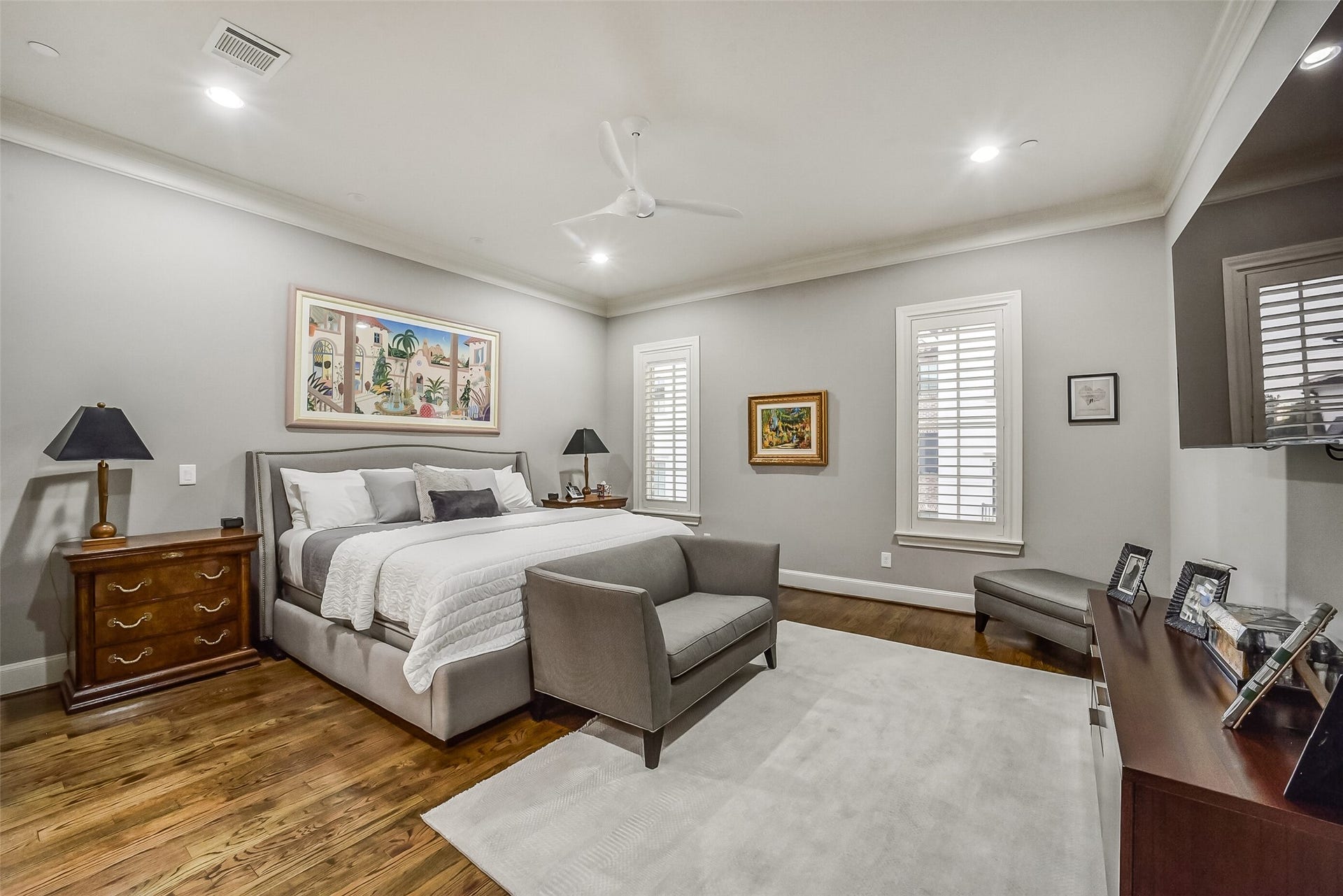 11 Southside Circle, Southside Place, TX 77025 Private second-floor primary suite offers plenty natural lighting and provides ample space for a king sized bed and cozy seating area.